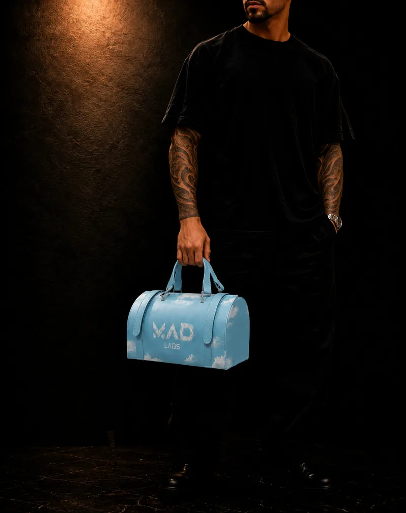 Man carrying a Mad Labs cloud print bag